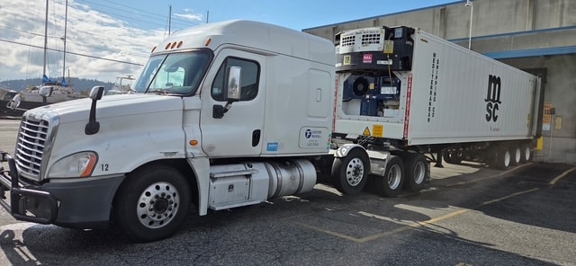 Flintstone Trucking fleet truck hauling a container